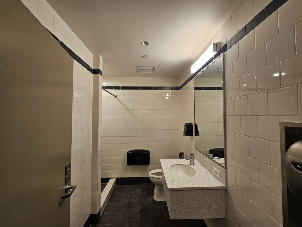 Single-use bathroom with toilet, sink, and shower single use bathroom