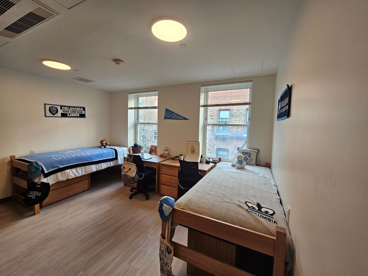 double room showing two beds and two desk