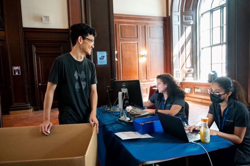 A student being helped at a Check-In table