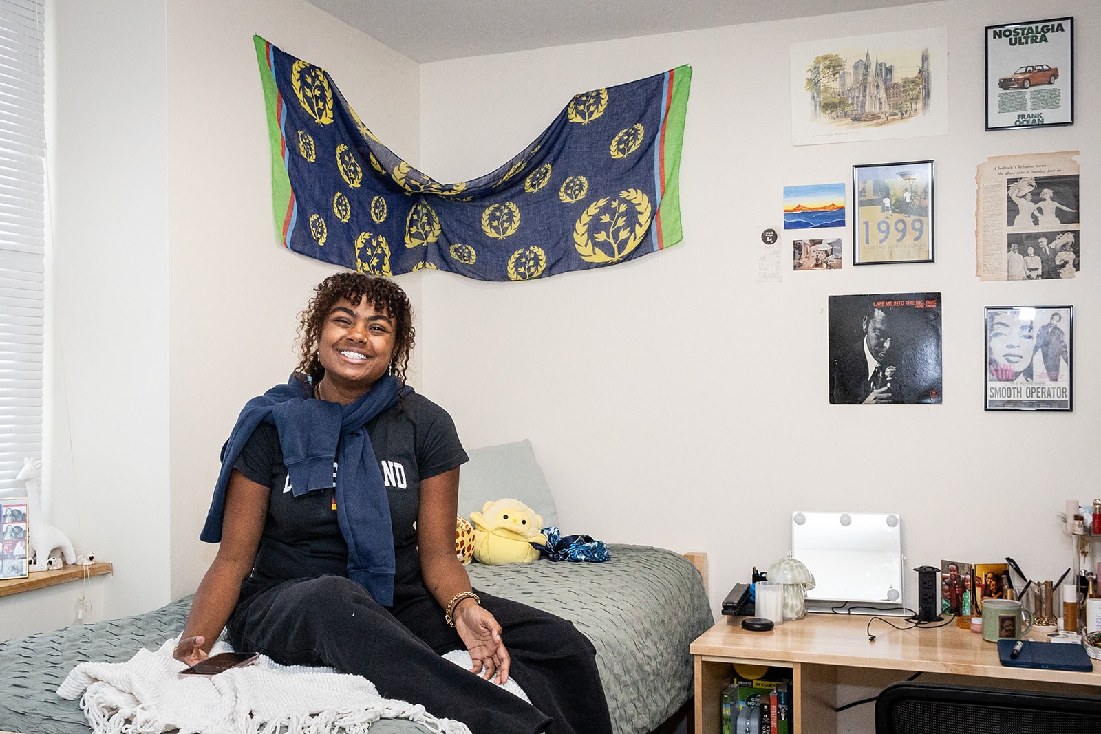 A student sitting on her bed