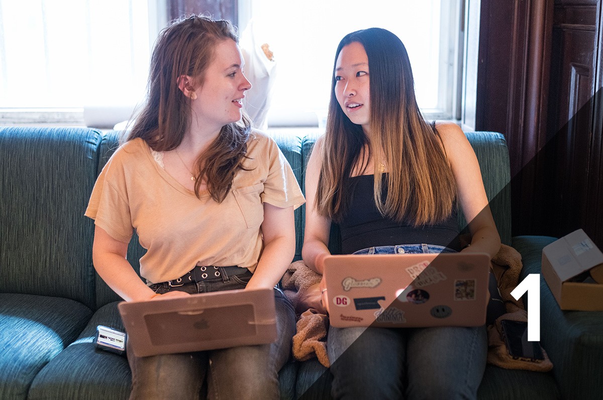 Two students working on their laptops