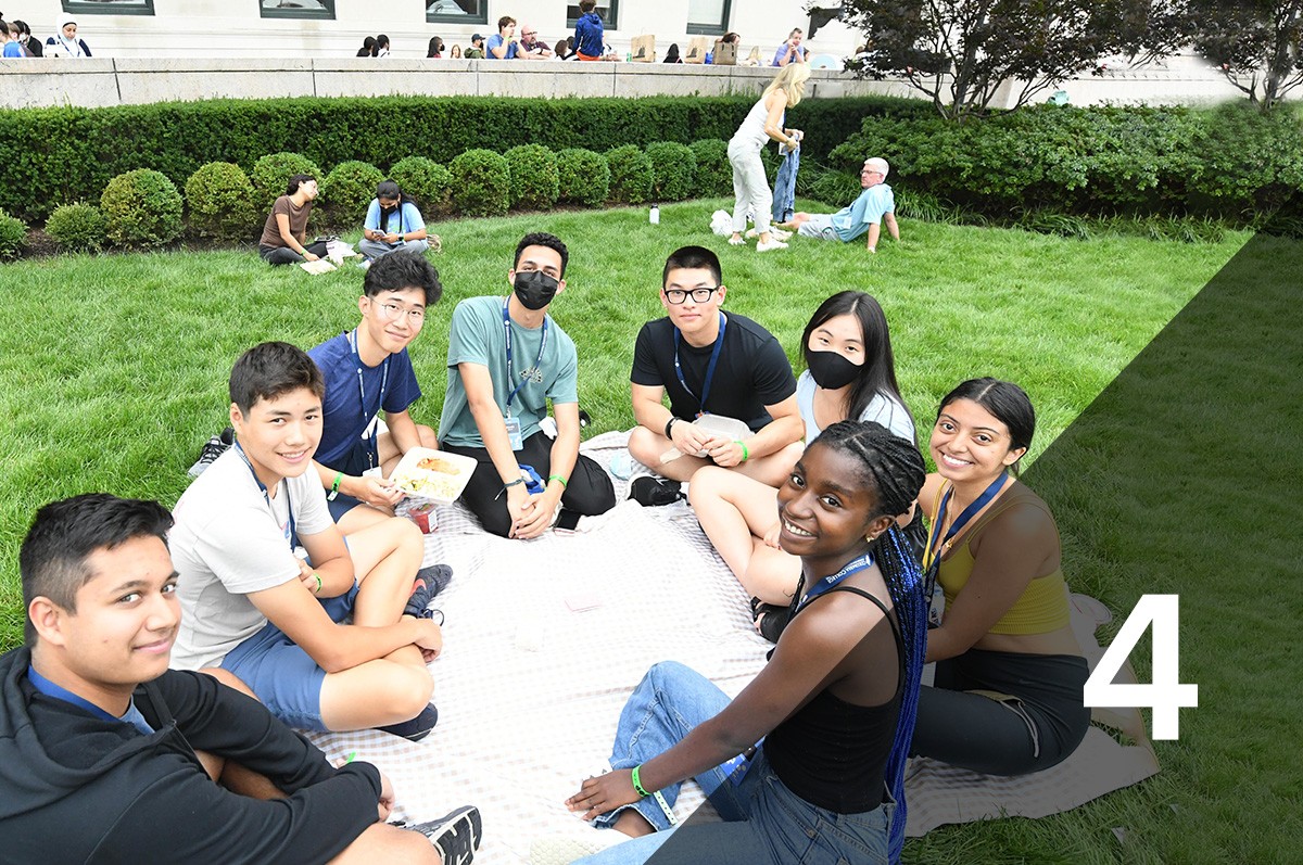 #4: a group of students sitting on the lawn