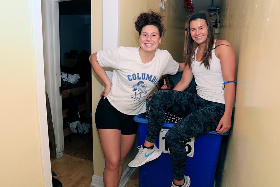 Students with a blue bin