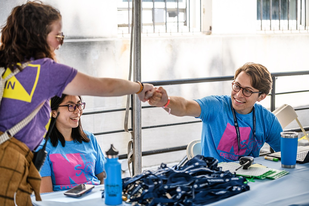 Students at a check in table