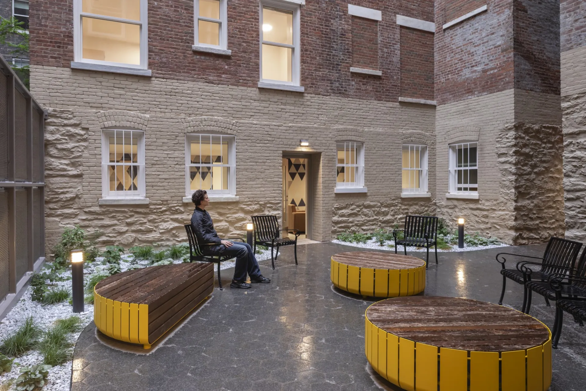 Student enjoying the outdoor courtyard of 611 W. 112th St.