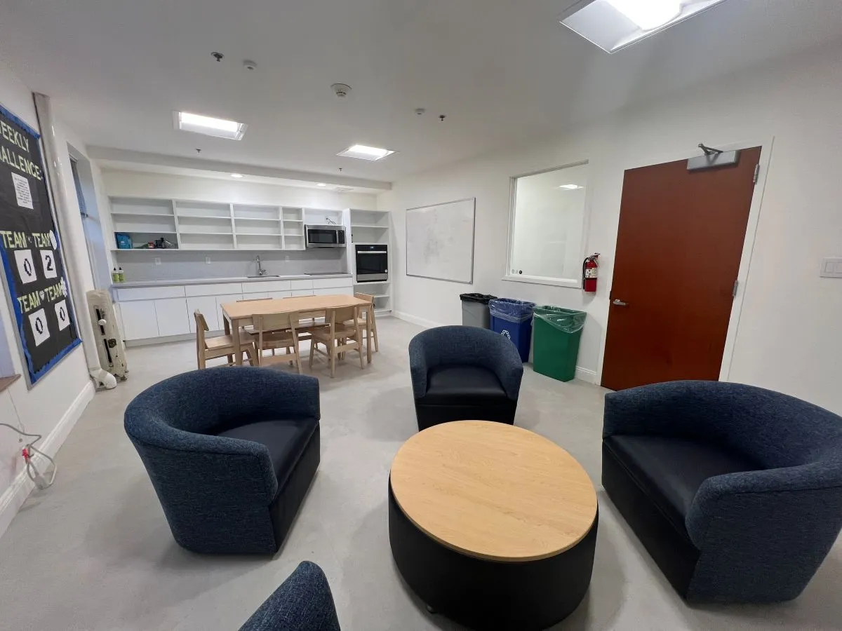 arm chairs and coffee table in kitchen lounge