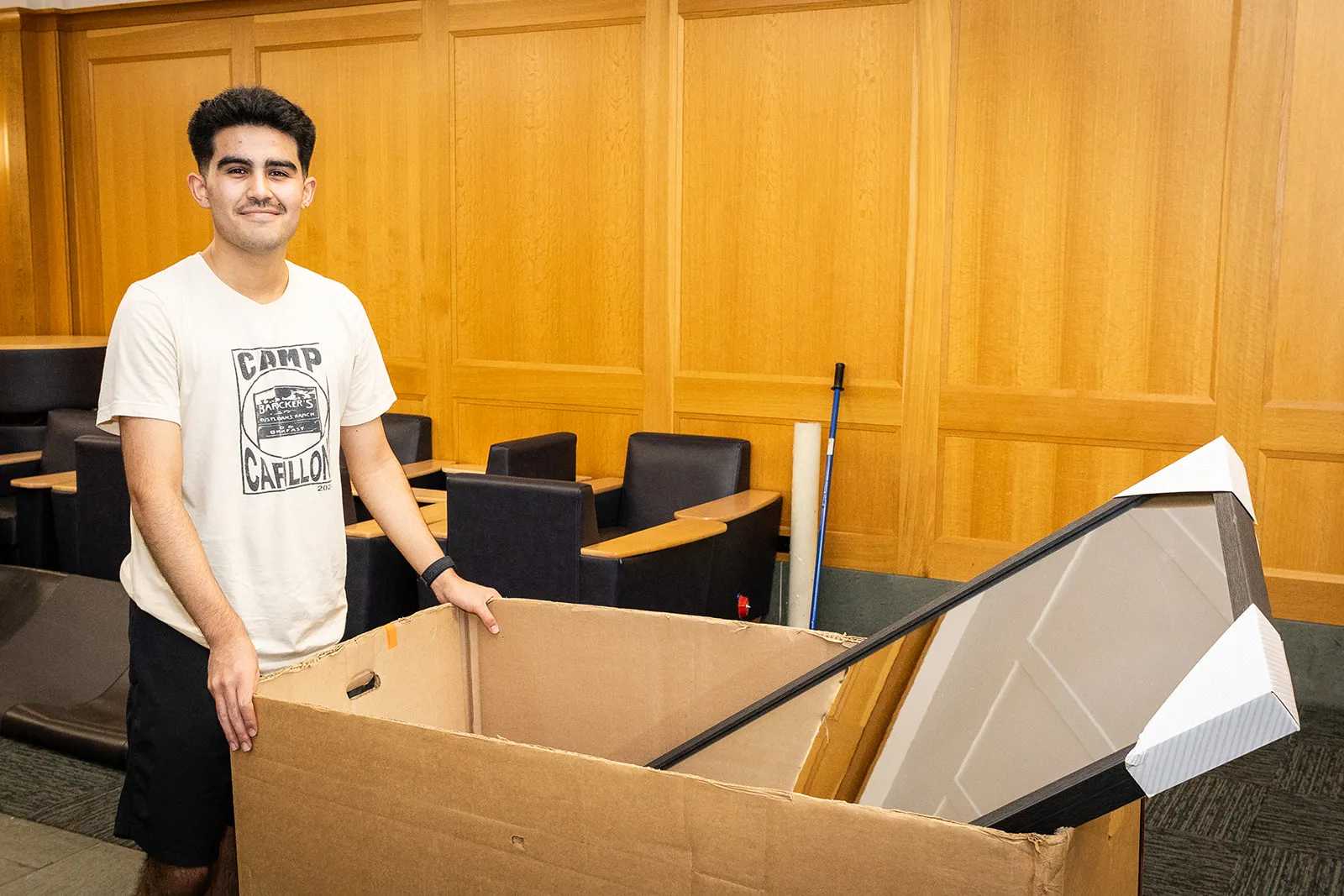 Student with a bin