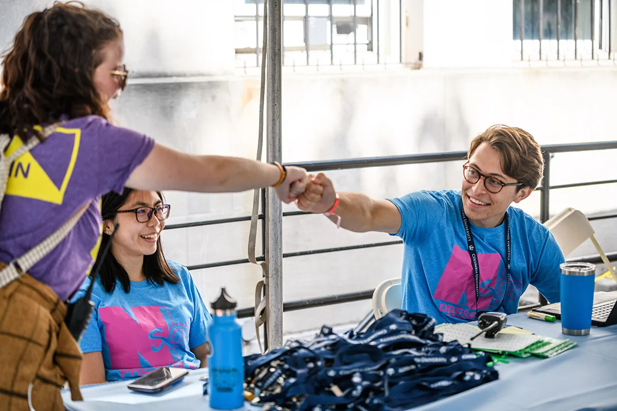 Students at a check in table
